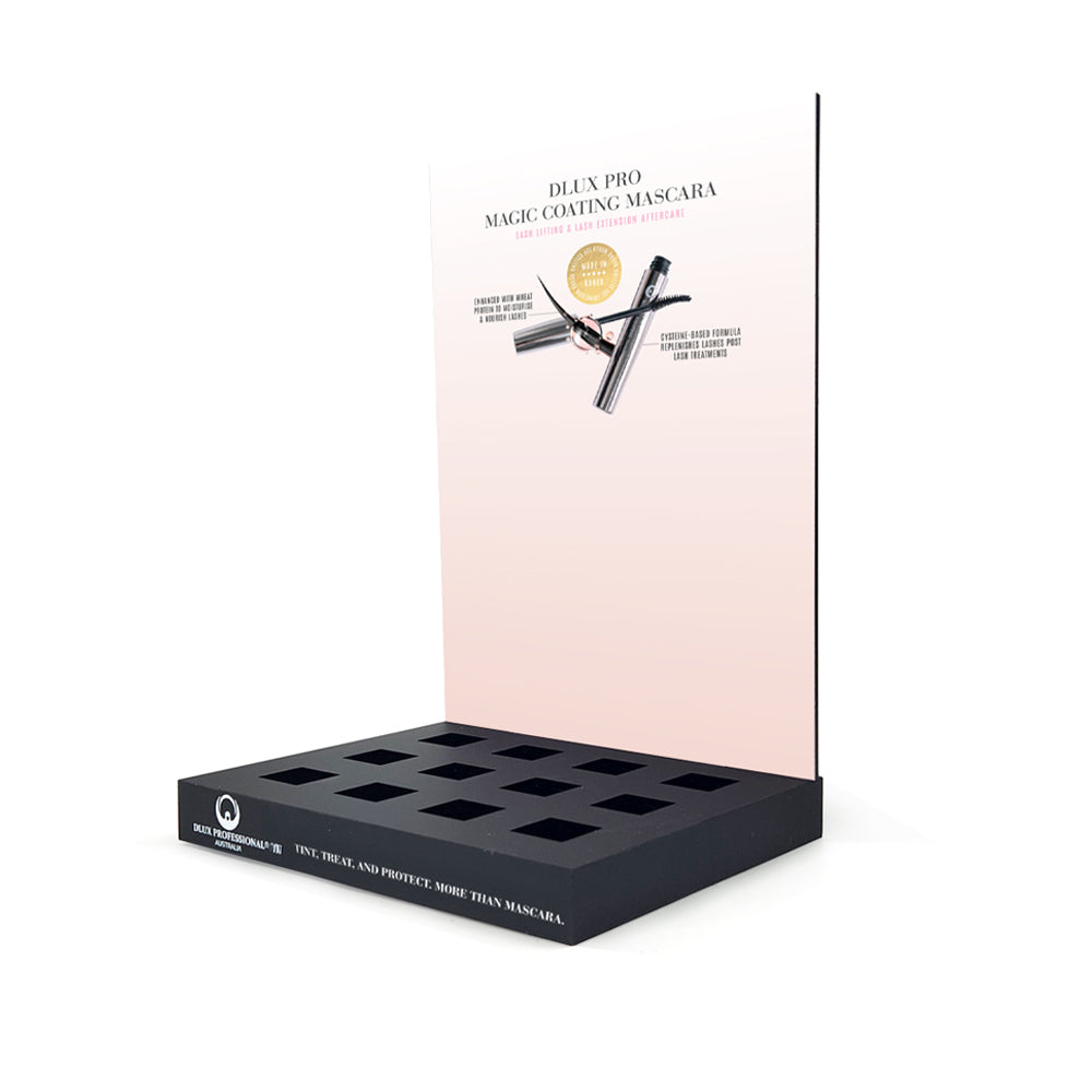 Display stand with black tray and pink back panel featuring mascara product information.
