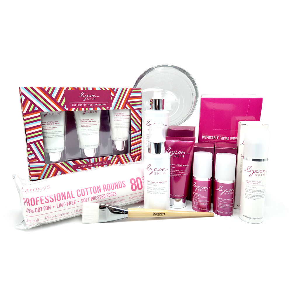 Collection of skincare products including bottles, a box, and cotton rounds on a white background