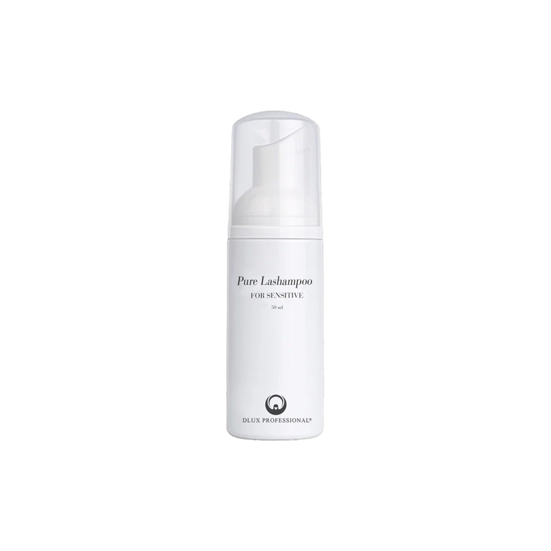 White bottle of Pure Lashampoo for sensitive skin on a white background