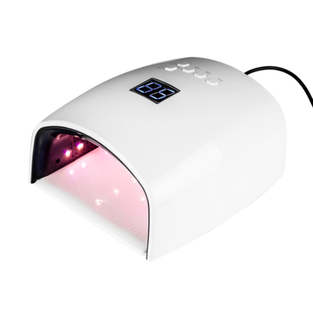 White UV LED nail lamp with a digital temperature display showing 65 degrees and a pink light glowing from the interior, on a white background.
