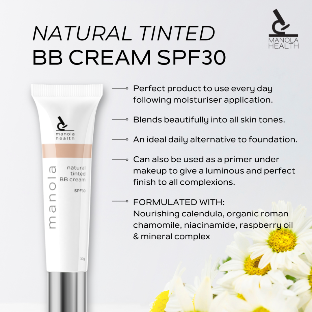 A tube of Manola Health Natural Tinted BB Cream SPF 30 shown on a light gray background with marketing text and white daisy flowers at the bottom right.