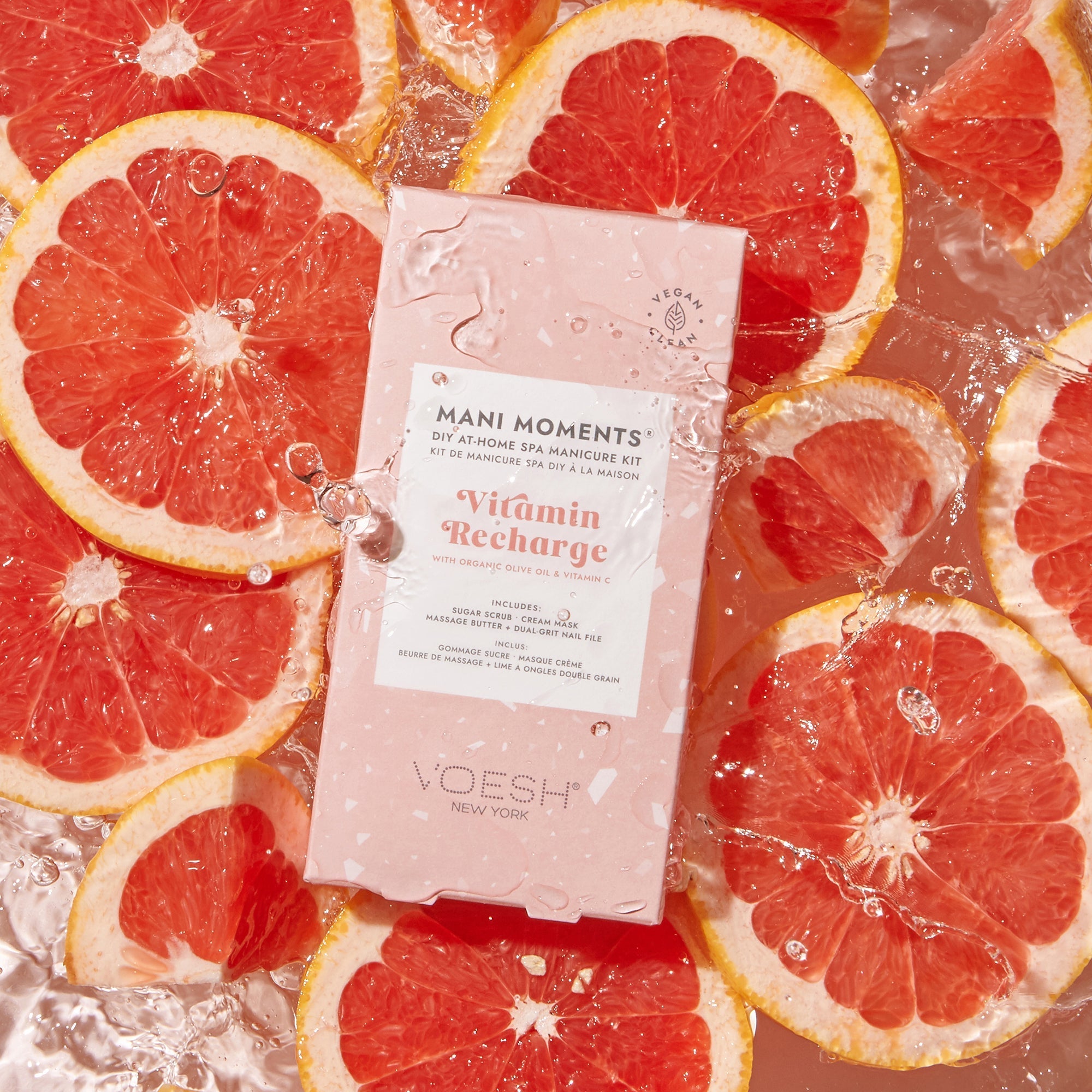 VOESH mani moments product on sliced grapefruits with water droplets
