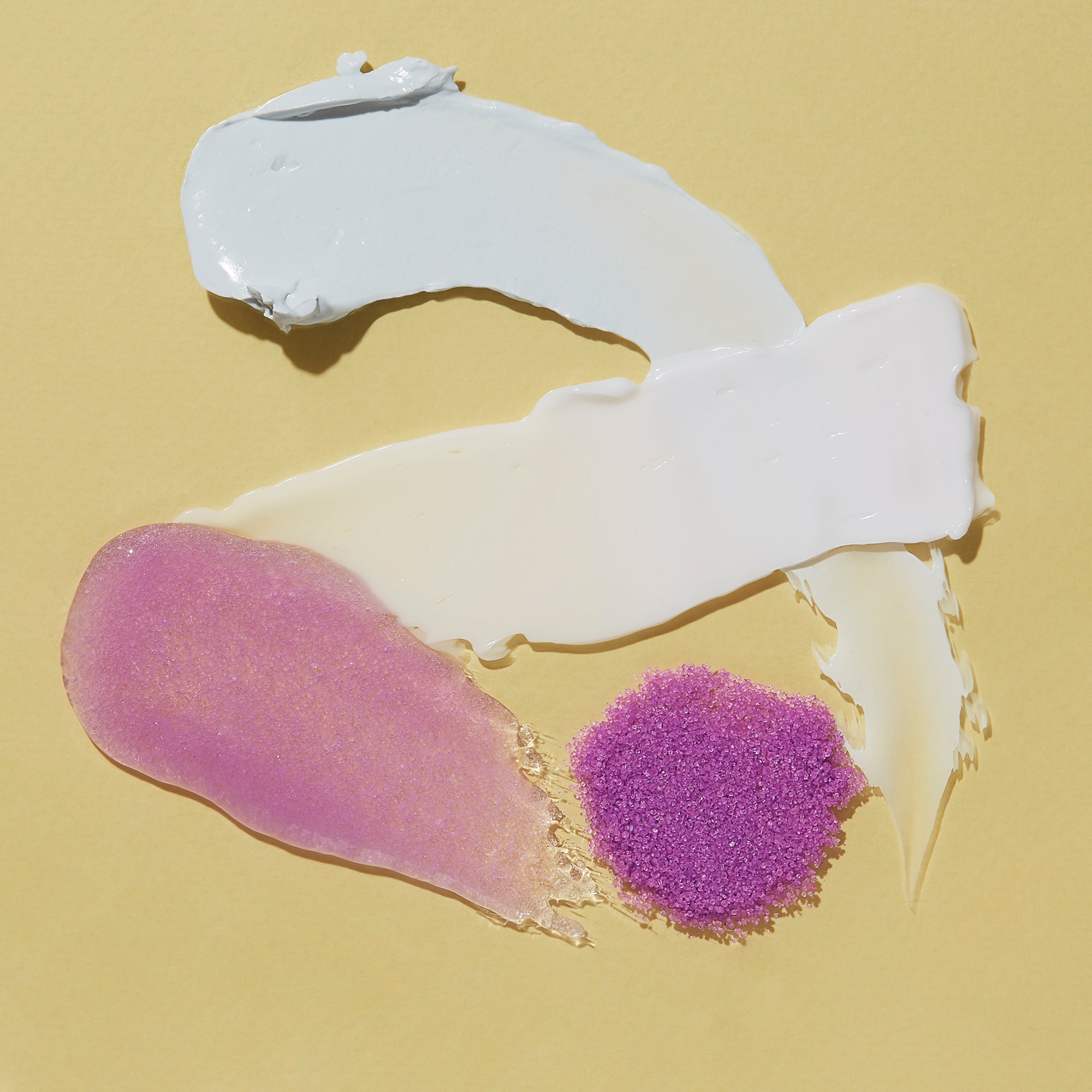 White and pink textured object on a beige background